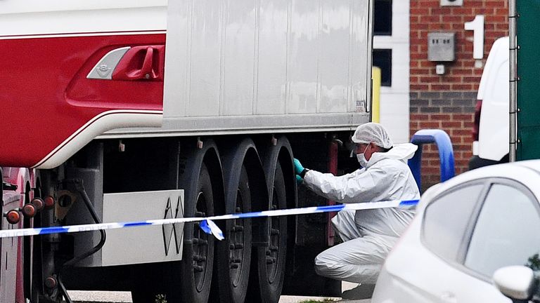 Forensic officers investigate the lorry
