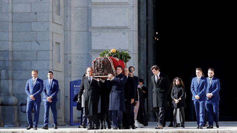 Family members carry the coffin of Spanish dictator Francisco Franco out of the basilica 
