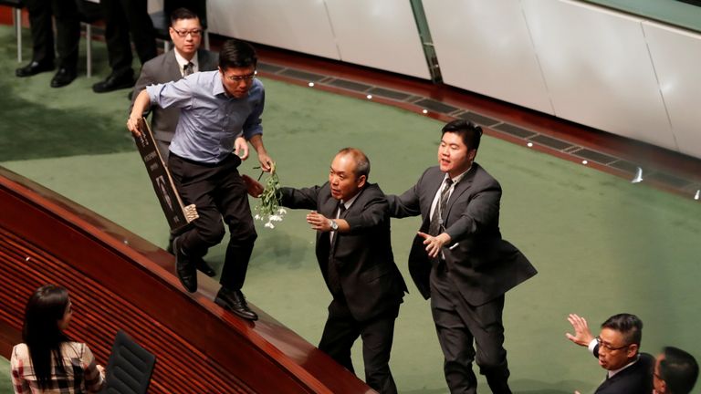 A pro-democracy politician tried to escape security guards in the LegCo chamber