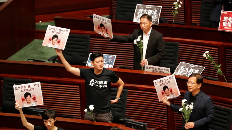 The 12 politicians wore t-shirts that said 'five demands, not one less'