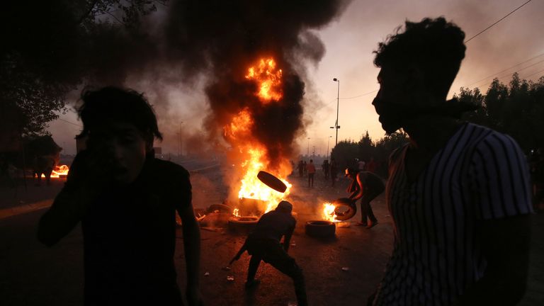 Iraqi protesters burn tyres during a protest on Saturday