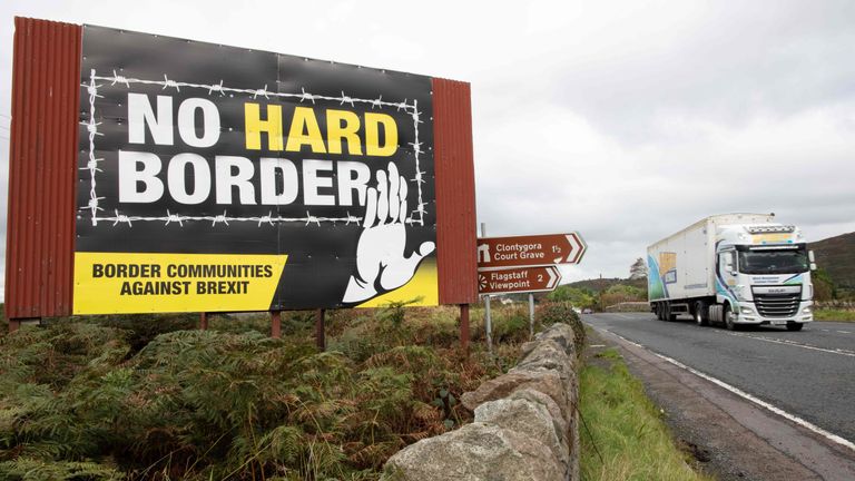 A truck passes an anti-Brexit pro-Irish unity billboard seen from the Dublin road in Newry, Northern Ireland, on October 1, 2019 on the border between Newry in Northern Ireland and Dundalk in the Irish Republic