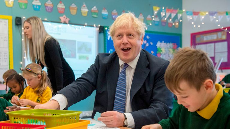 Britain&#39;s Prime Minister Boris Johnson speaks to pupils as he visits Middleton Primary School in Milton Keynes, southern England on October 25, 2019. - UK Prime Minister Boris Johnson on October 24 proposed settling the Brexit crisis through an early election on December 12 that could help Britain finally find a way out of the European Union. (Photo by Paul Grover / POOL / AFP) (Photo by PAUL GROVER/POOL/AFP via Getty Images)
