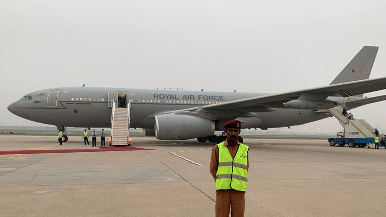 Pakistani security is seen on the tarmac in front of the Royal Air Force plane in Lahore, Pakistan, October 17, 2019. The Royal Air Force plane carrying the royal couple was forced to abort a landing in Islamabad twice on Thursday and return to Lahore after being caught in a severe thunderstorm. REUTERS/Peter Nicholls