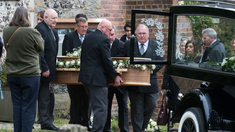 Miss Squire's casket is carried back to the hearse