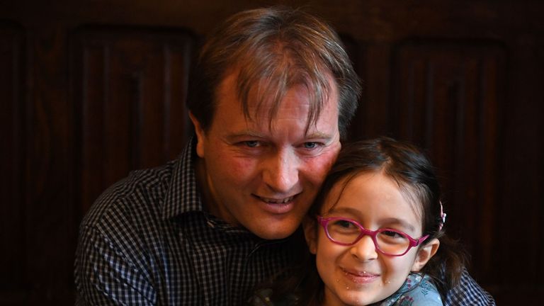 Richard Ratcliffe, husband of British-Iranian humanitarian worker Nazanin Zaghari-Ratcliffe, imprisoned in Tehran since 2016, holds his daughter Gabriella during a press conference