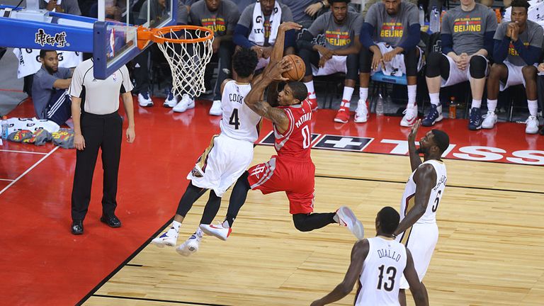 The Houston Rockets playing against the New Orleans Pelicans in China