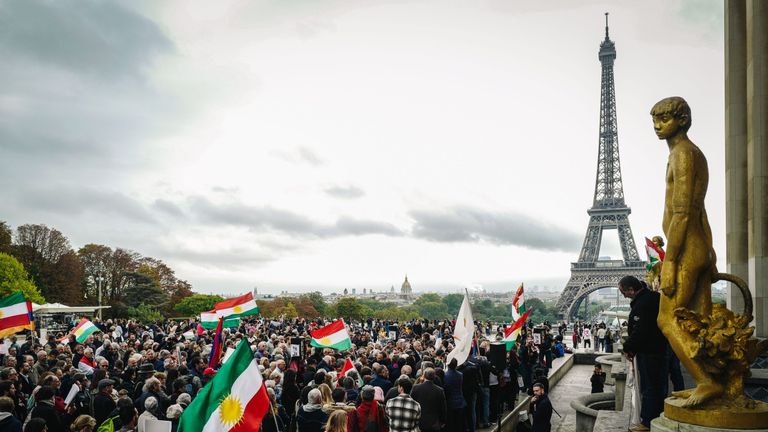 People take part in a demonstration at the Human Rights plaza in Paris on October 12, 2019, to support Kurdish militants as Turkey kept up its assault on Kurdish-held border towns in northeastern Syria today, on the fourth day of an offensive that is drawing growing international condemnation, even from Washington