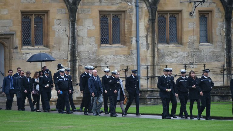 Mourners arrive at the service in Oxford