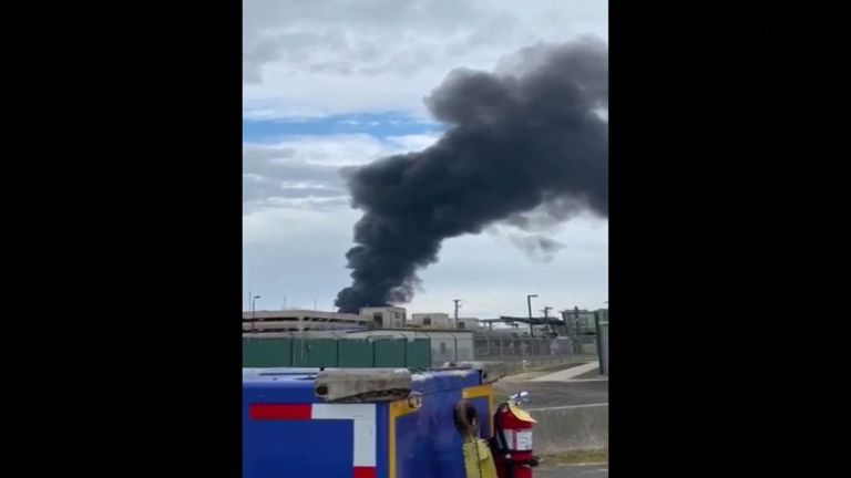 The plane burst into flames after crashing into an airport building