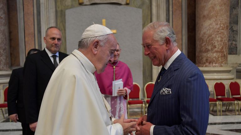 Pope Francis speaks with Britain&#39;s Prince Charles at the Vatican