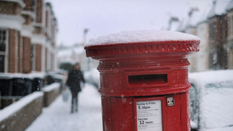 A post box covered with snow in Clapham, London
