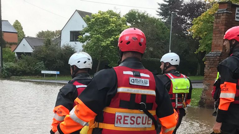 Rescue workers were seen walking through a residential area in Leicestershire earlier 