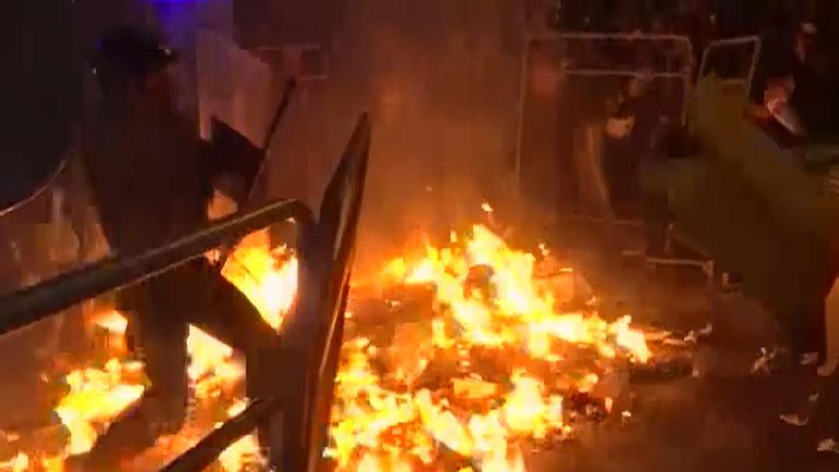 Riot police walk through fire as Barcelona protests intensify