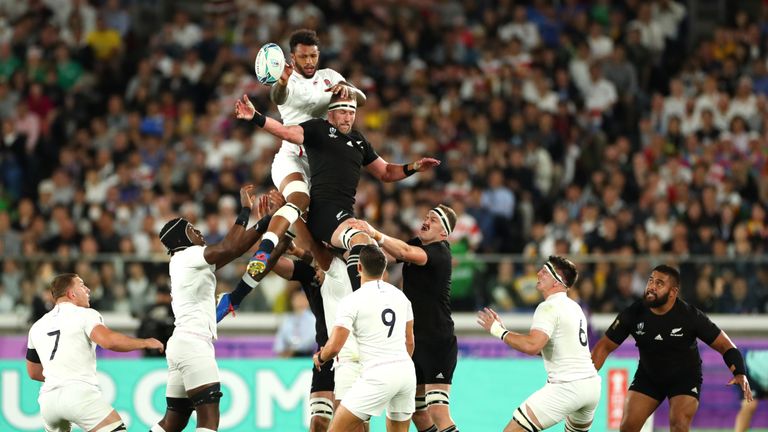 Courtney Lawes of England steals a line-out from Kieran Read of New Zealand