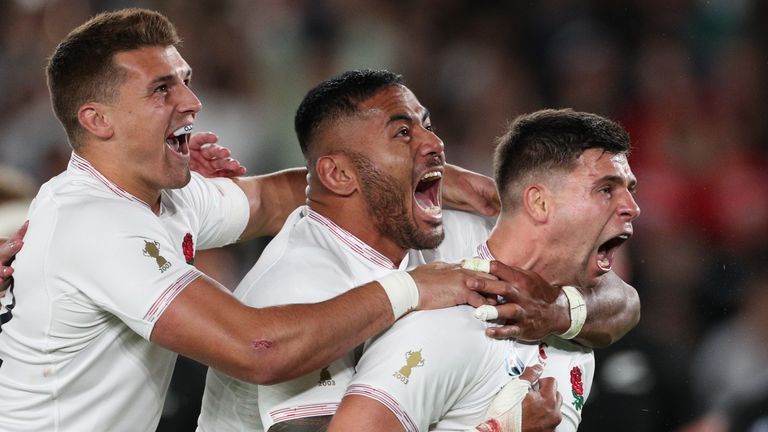 Ben Youngs of England celebrates with teammates Manu Tuilagi and Henry Slade