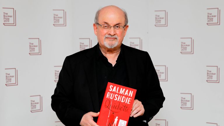 British author Salman Rushdie poses with his book Quichotte during the photo call for the authors shortlisted for the 2019 Booker Prize for Fiction