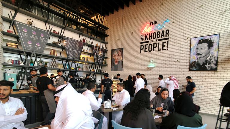 Saudi women sit among men in a newly opened cafe in August