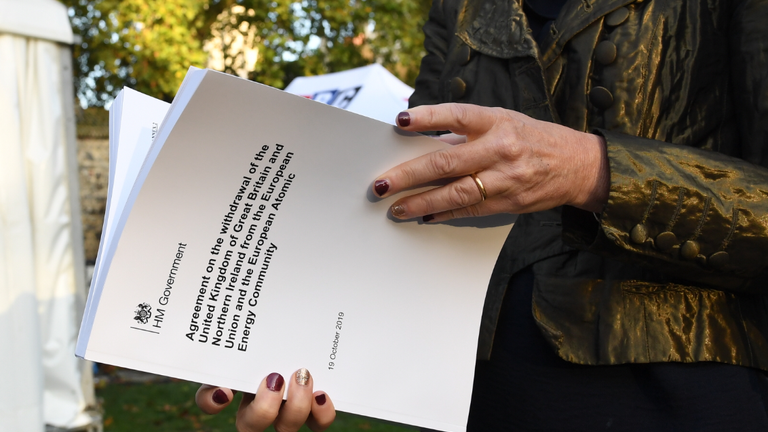 MP Liz Saville-Roberts holds a copy of the Withdrawal Agreement outside the Houses of Parliament in London ahead of Prime Minister Boris Johnson delivering a statement in the House of Commons on his new Brexit deal after the EU Council summit, on what has been dubbed "Super Saturday".