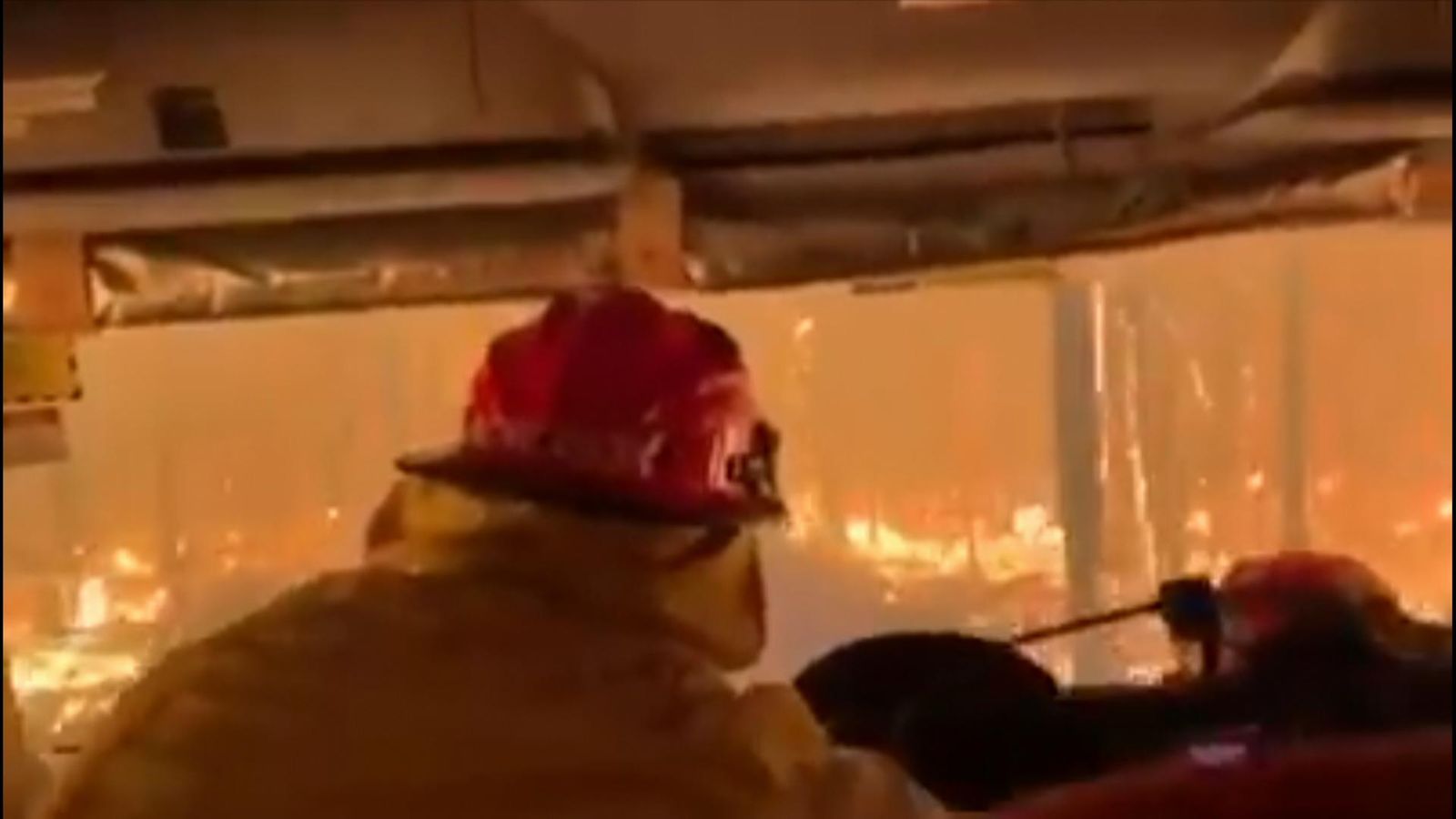 Australia: Dramatic video shows firefighters driving through bushfire ...