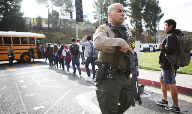 Two dead and gunman in hospital after shooting at US high school