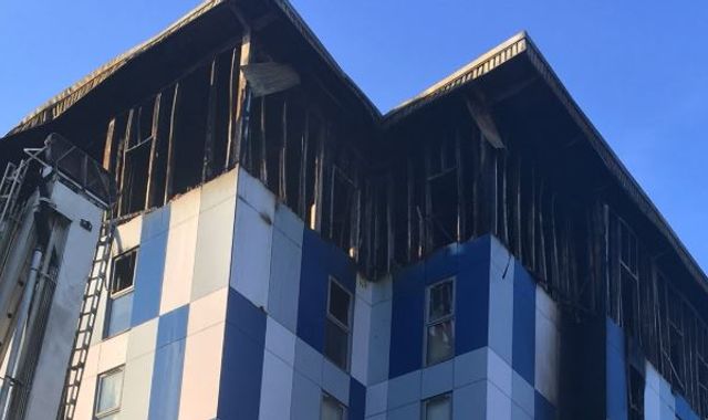 Two injured after flames 'crawled up cladding' at student flats