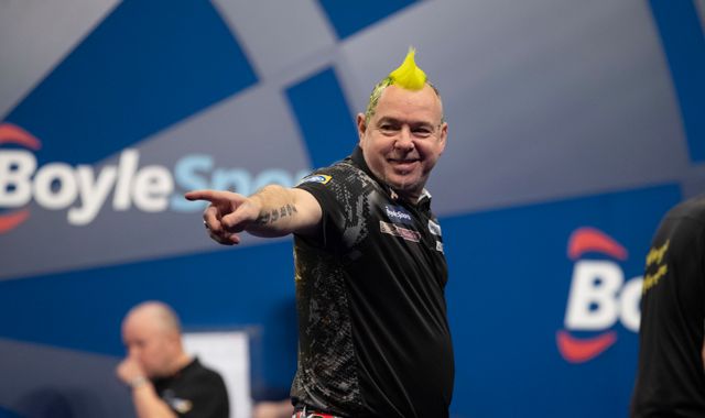 Peter Wright thrashes Rob Cross to ease into the Grand Slam quarter-finals