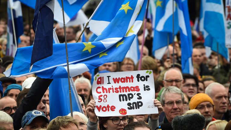 Paricipants hold a variety of flags as they attend a rally calling for Scottish independence in Glasgow, on November 2, 2019. (Photo by ANDY BUCHANAN / AFP) (Photo by ANDY BUCHANAN/AFP via Getty Images)