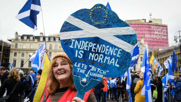 A pro-independence supporter displays a placard at a rally calling for Scottish independence in Glasgow, on November 2, 2019. (Photo by ANDY BUCHANAN / AFP) (Photo by ANDY BUCHANAN/AFP via Getty Images)