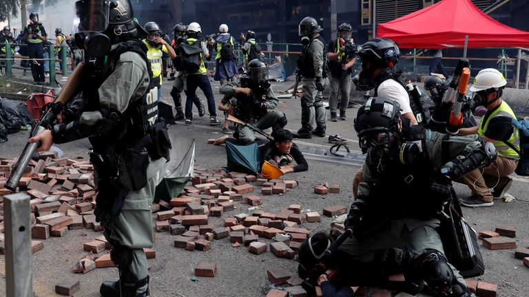 Police detain protesters who attempt to leave the campus of Hong Kong Polytechnic University (PolyU) during clashes with police in Hong Kong, China November 18, 2019. REUTERS/Tyrone Siu
