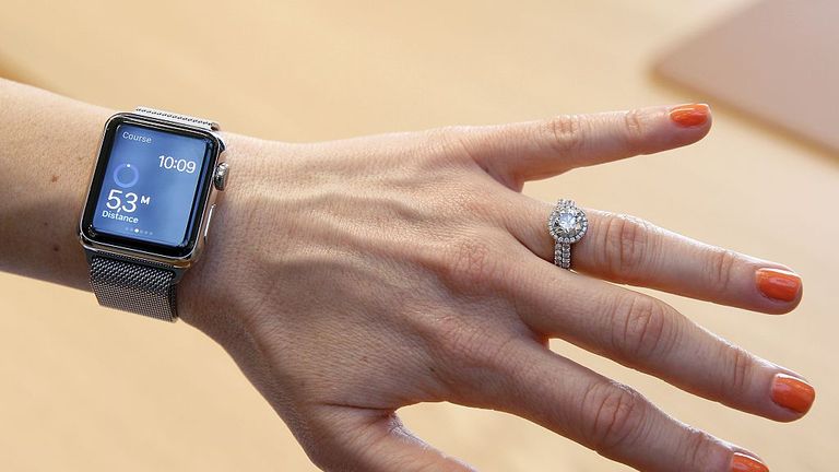 PARIS, FRANCE - APRIL 10: A customer tries on an Apple Watch smartwatch at Galeries Lafayette Paris Haussmann on April 10, 2015 in Paris, France. Pre-orders for the Apple Watch are available to customers on the Apple online store from April 10, with the first shipments scheduled for April 24. (Photo by Chesnot/Getty Images)
