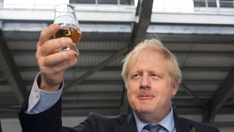 Boris Johnson tastes whisky at the Roseisle Distillery in Scotland near Moray at the start of the General Election campaign