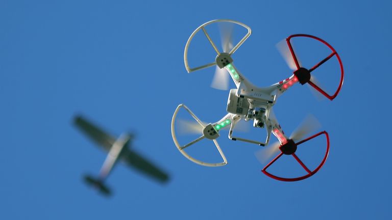 OLD BETHPAGE, NY - SEPTEMBER 05: A drone is flown for recreational purposes as an airplane passes nearby in the sky above Old Bethpage, New York on September 5, 2015. (Photo by Bruce Bennett/Getty Images)

