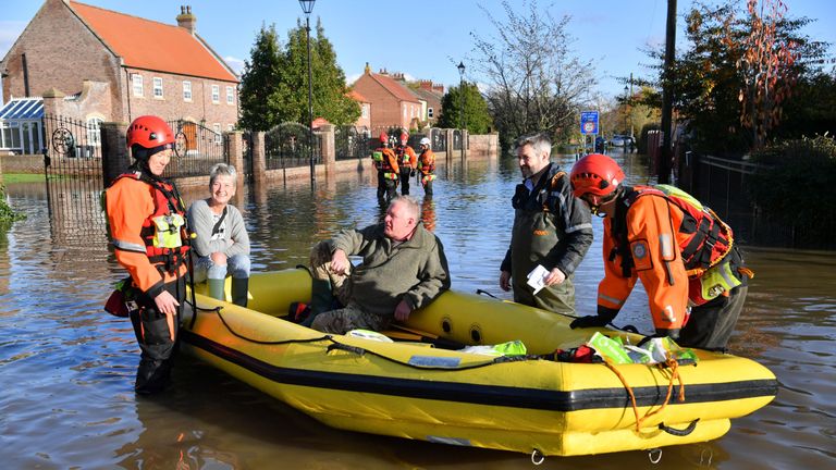 Fire and rescue crews transport people through floodwater to other parts of Fishlake, Doncaster 