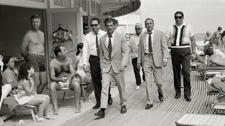 Frank Sinatra, with his minders and his stand in while filming, The Lady in Cement. Pic: Terry O&#39;Neill/Iconic Images