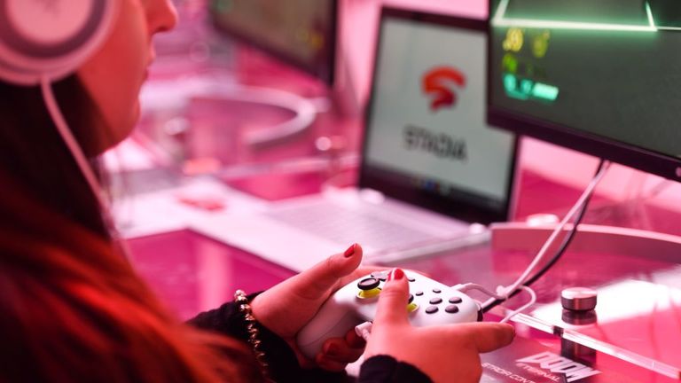 A visitor plays a cloud-game at the stand of Google Stadia during the Video games trade fair Gamescom in Cologne, western Germany, on August 21, 2019. (Photo by Ina FASSBENDER / AFP) (Photo credit should read INA FASSBENDER/AFP via Getty Images)

