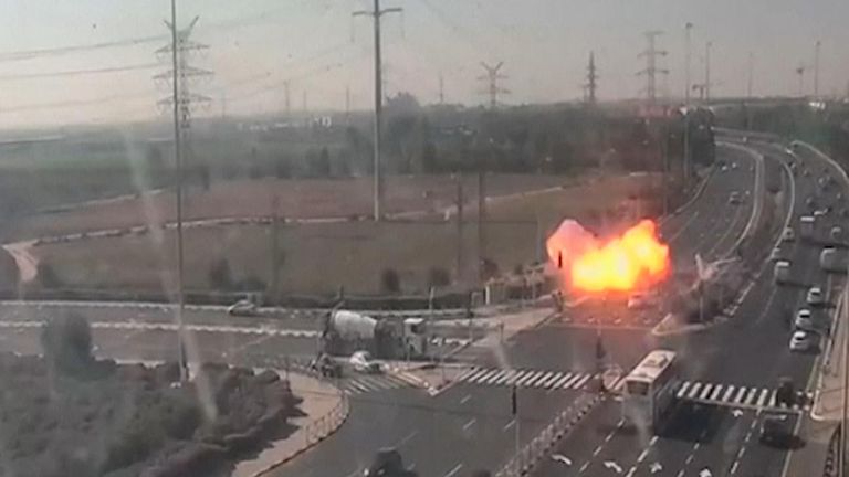 Video from a traffic camera in central Israel captured the moment on Tuesday when a rocket strikes a major highway only metres from several passing vehicles.