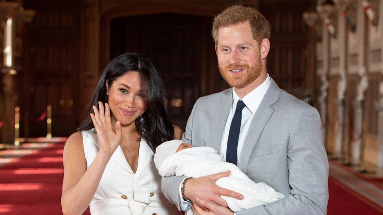 The duke and duchess pose with the newborn son in May