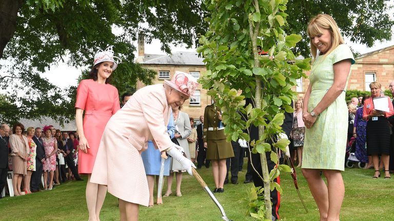The Queen plants a tree in Northern Ireland in 2014