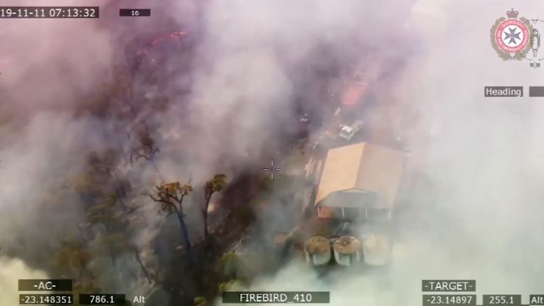 Smoke engulfs a property following the spread of bushfires in Queensland, Australia, November 11, 2019. Picture taken November 11, 2019. Pic: Queensland Fire and Emergency Services