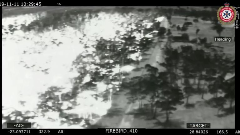 An aerial view in black and white shows the spread of bushfires (L) in Queensland, Australia, November 11, 2019. Picture taken November 11, 2019. Pic: Queensland Fire and Emergency Services