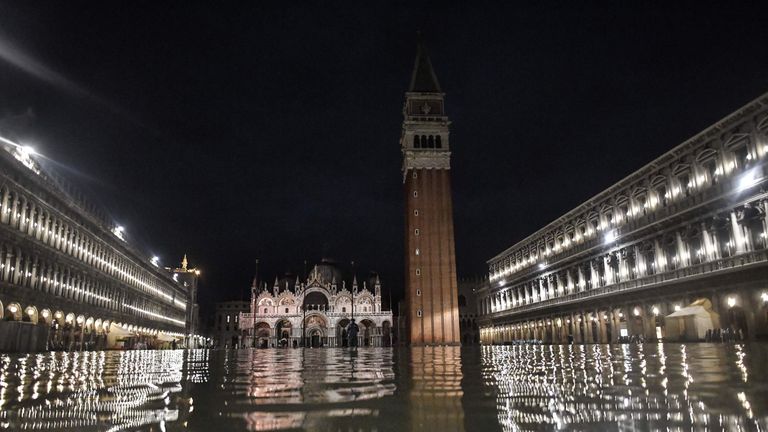 The flooded San Marco square with St. Mark&#39;s Basilica and the Bell Tower are pictured during an exceptional "Alta Acqua" high tide water level on November 12, 2019