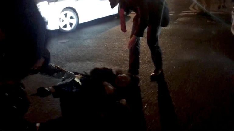 Teresa Cheng falls after protesters surrounded her 