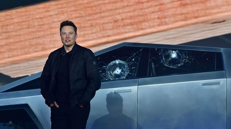 Tesla co-founder and CEO Elon Musk stands in front of the shattered windows of the newly unveiled all-electric battery-powered Tesla&#39;s Cybertruck at Tesla Design Center in Hawthorne, California on November 21, 2019. (Photo by FREDERIC J. BROWN / AFP) (Photo by FREDERIC J. BROWN/AFP via Getty Images)

