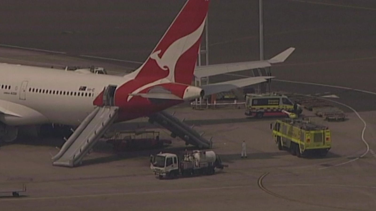 Qantas flight evacuated using slides as cabin starts to fill up with ...