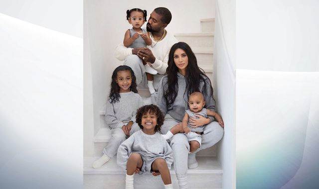 Kim Kardashian unveils Christmas card featuring smiling, happy family