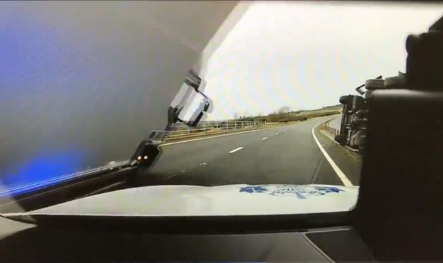 Policeman has lucky escape after lorry falls on car