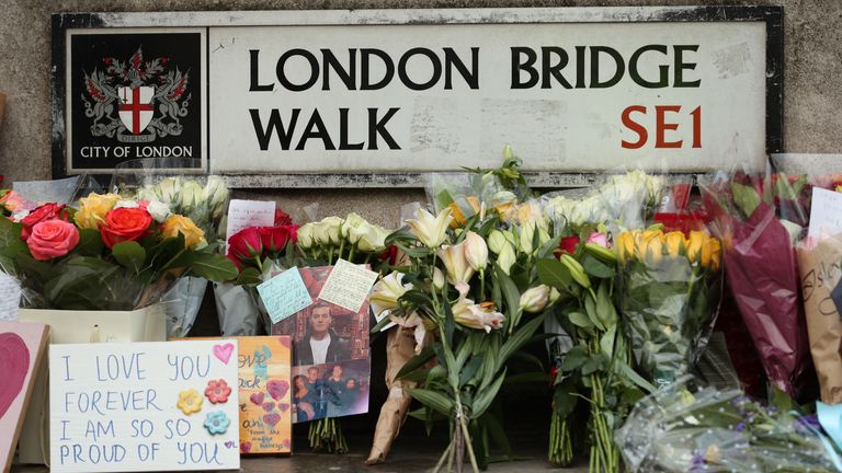 Floral tributes for victims of the terrorist attack, including Jack Merritt, left on London Bridge in central London, after a terrorist wearing a fake suicide vest who went on a knife rampage killing two people, was shot dead by police on Friday.