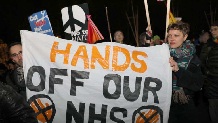 NHS nurses and doctors protest outside Buckimngham Palace , London, during a 