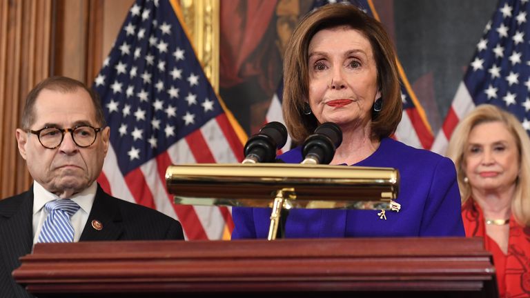 Speaker of the House Nancy Pelosi (C), flanked by House Judiciary Chairman Jerry Nadler, (L) (D-NY) and House Committee on Oversight and Reform Chairwoman Carolyn Maloney (R) (D-NY), announces articles of impeachment against US President Donald Trump during a press conference at the US Capitol in Washington, DC, December 10, 2019. - Democrats listed abuse of power and obstruction of Congress. (Photo by SAUL LOEB / AFP) (Photo by SAUL LOEB/AFP via Getty Images)